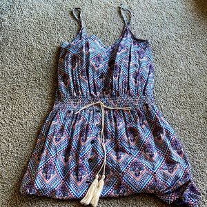 Maxi length, spaghetti strap patterned dress.